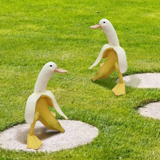 Banana Duck Resin Garden Ornament with vibrant yellow colour and cartoon design