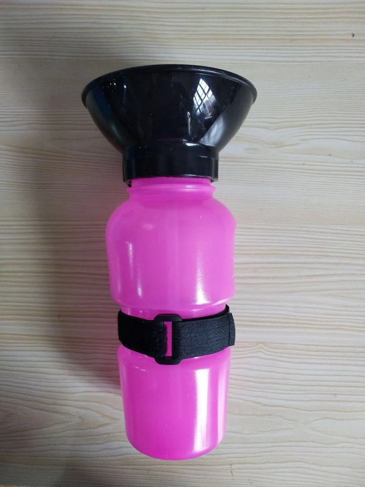 Portable pet water bottle with squeeze-feed bowl for dogs and cats