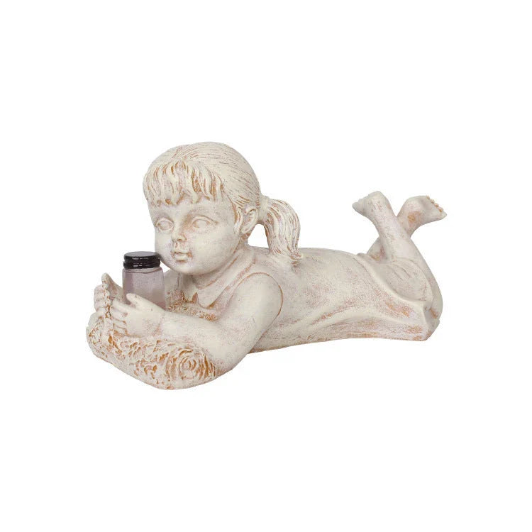 Enchanting solar-powered resin garden statue with delightful firefly lights for decorating outdoor spaces in the UK