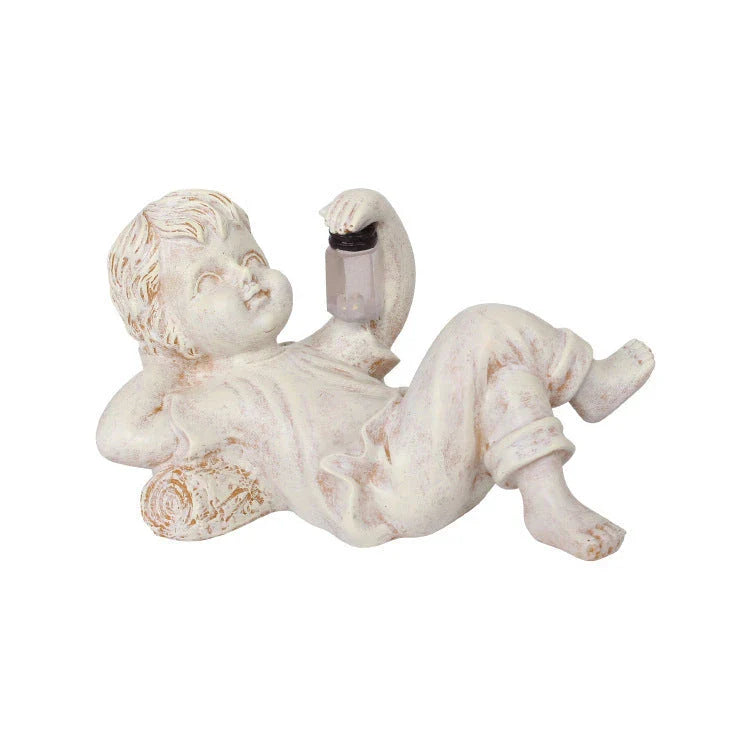 Enchanting solar-powered resin garden statue with delightful firefly lights for decorating outdoor spaces in the UK