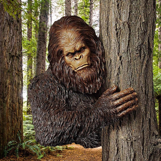 Bigfoot 3D Resin Tree Decoration peeking around a tree, perfect for gardens and shelves