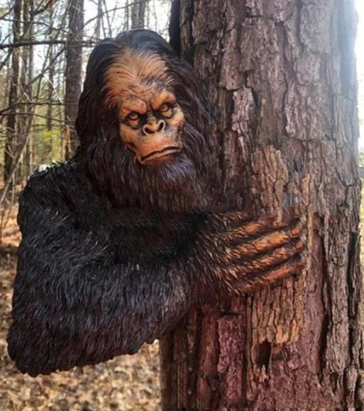 Bigfoot 3D Resin Tree Decoration peeking around a tree, perfect for gardens and shelves