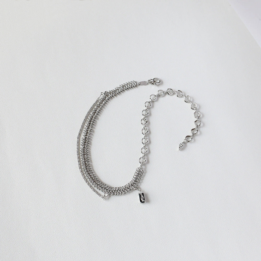 Elegant platinum-plated clavicle chain necklace with a delicate, frosty finish, perfect for adding refined glamour to any outfit.