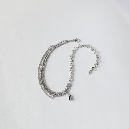 Elegant platinum-plated clavicle chain necklace with a delicate, frosty finish, perfect for adding refined glamour to any outfit.