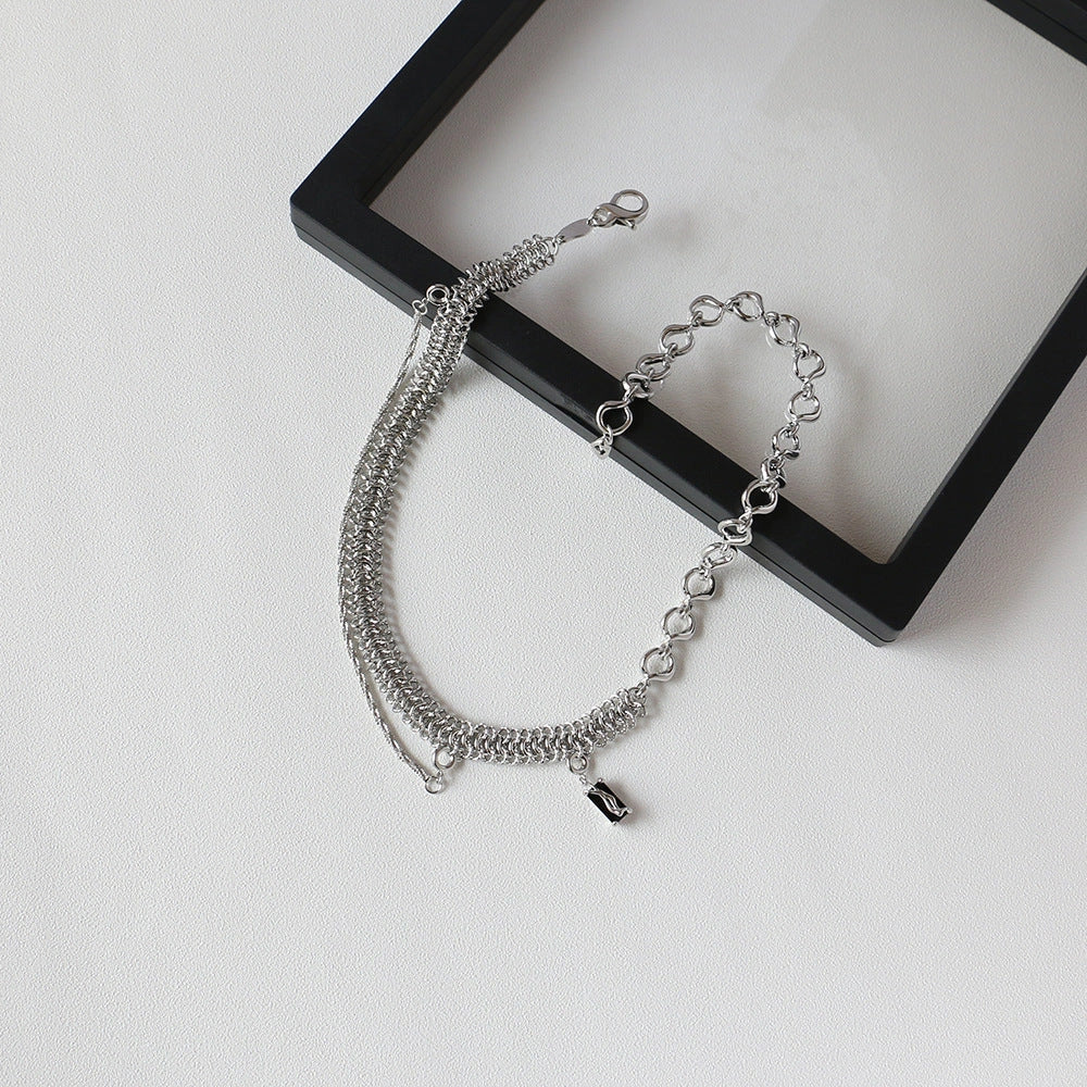 Elegant platinum-plated clavicle chain necklace with a delicate, frosty finish, perfect for adding refined glamour to any outfit.