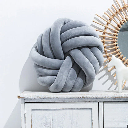 Cozy decorative pillows with knotted ball design in a variety of classic and on-trend color options for living rooms, bedrooms, and offices