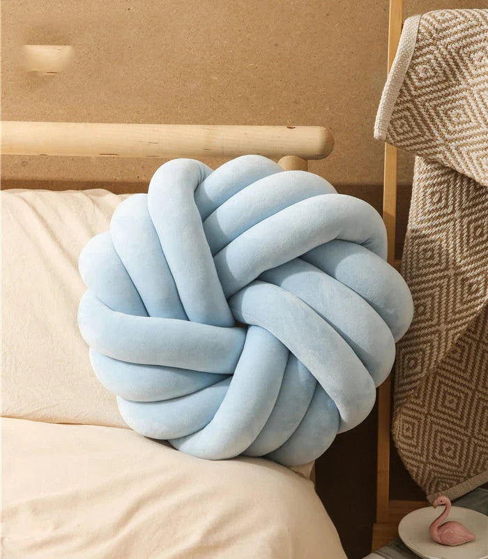 Cozy decorative pillows with knotted ball design in a variety of classic and on-trend color options for living rooms, bedrooms, and offices