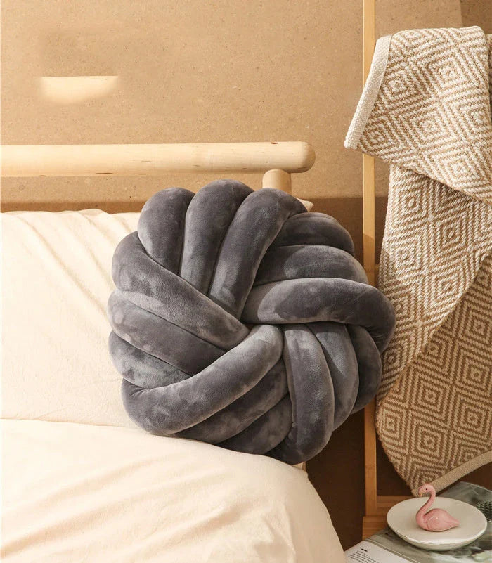 Cozy decorative pillows with knotted ball design in a variety of classic and on-trend color options for living rooms, bedrooms, and offices