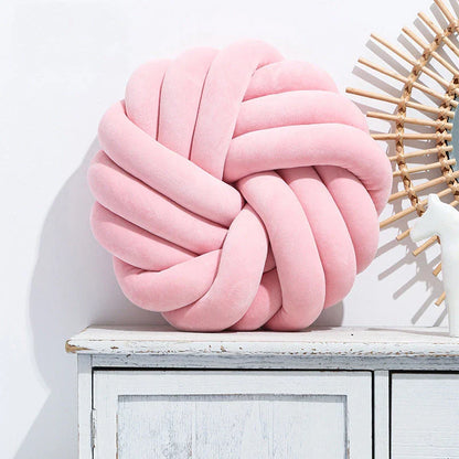 Cozy decorative pillows with knotted ball design in a variety of classic and on-trend color options for living rooms, bedrooms, and offices
