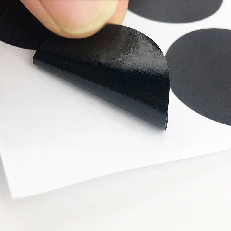 Circular PVC blackboard sticker labels on a jar, showing reusable and erasable features