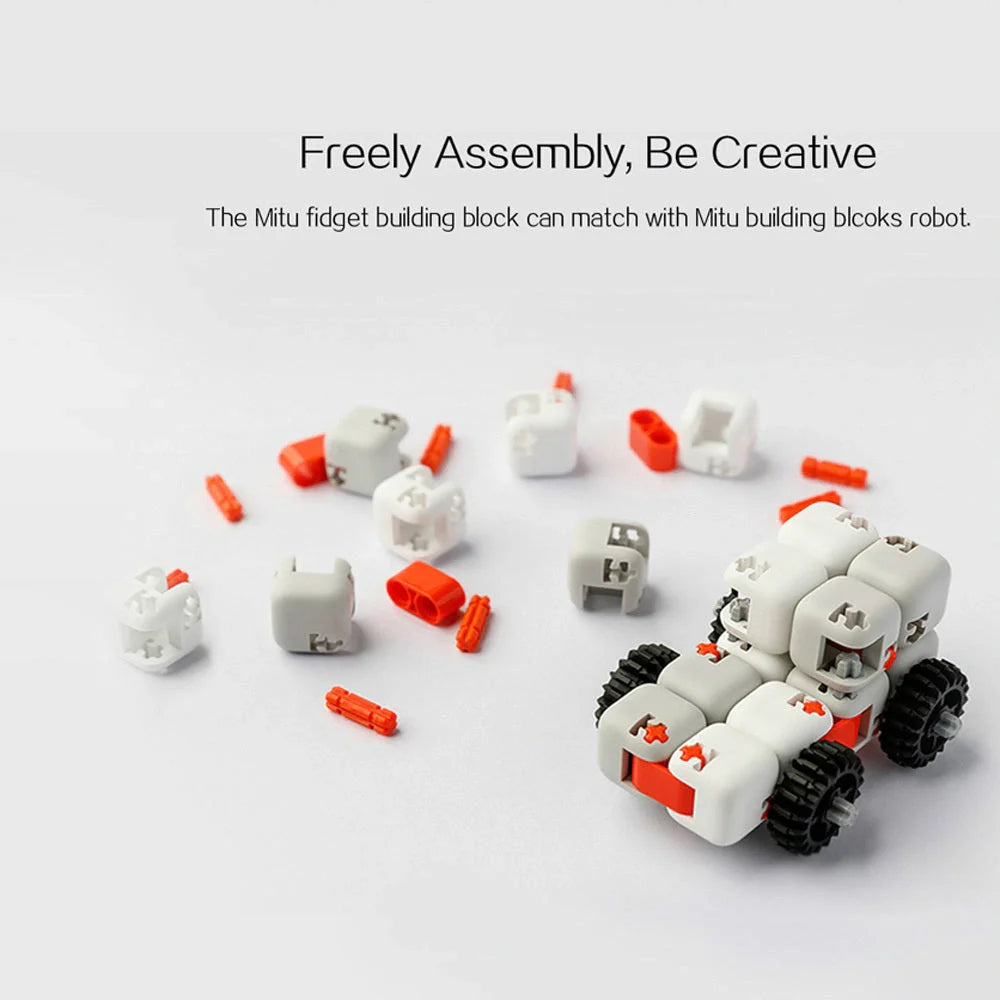 Mitu fidget building block puzzle in white, grey, and orange for stress relief and creative play