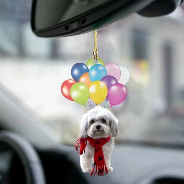 Charming cartoon dog car charm with vibrant balloon parachute design, a delightful automotive accessory for pet lovers