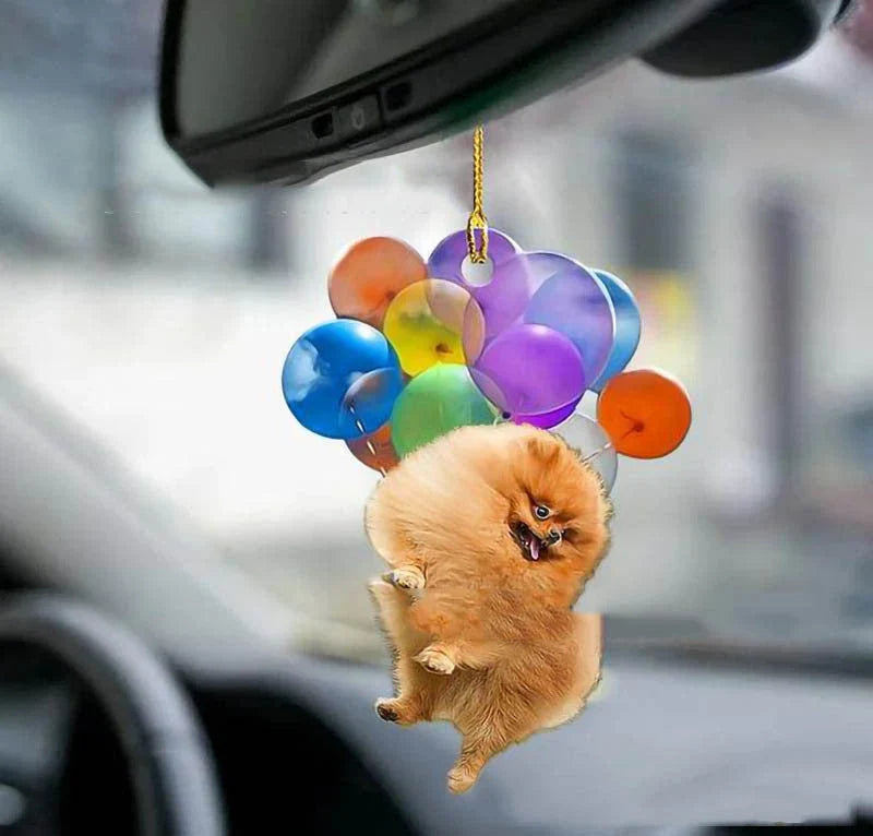 Charming cartoon dog car charm with vibrant balloon parachute design, a delightful automotive accessory for pet lovers