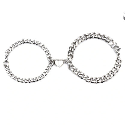 Elegant titanium steel couple bracelets with heart design, perfect for love gifts.