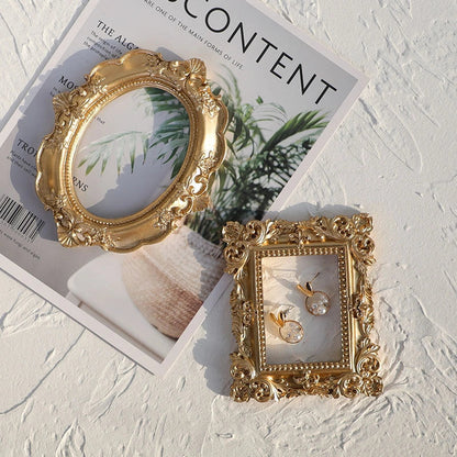 Golden Retro Photo Frame displaying jewellery and art in a Nordic-style resin design