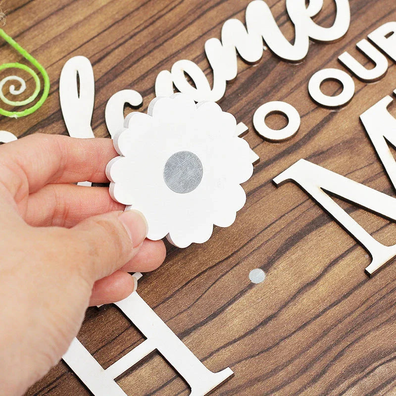 Versatile wooden door hanger with interchangeable seasonal decor including flowers, hearts, pumpkins, and more