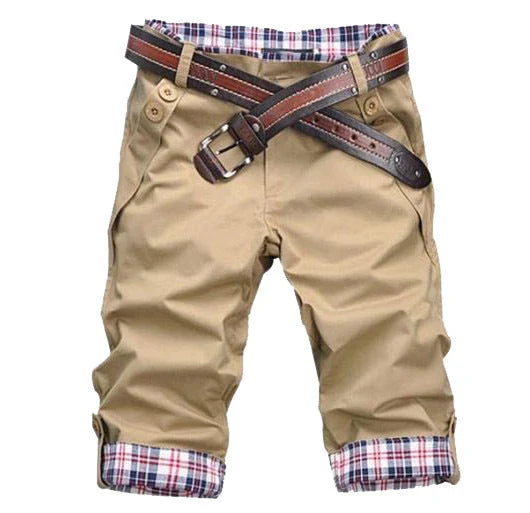 Classic British cotton shorts in a straight-leg silhouette, available in khaki, gray, and black colors.