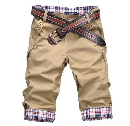 Classic British cotton shorts in a straight-leg silhouette, available in khaki, gray, and black colors.