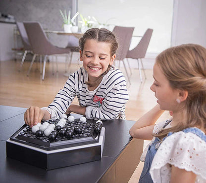 Abalone strategy game with marble board and pieces for family and kids to play