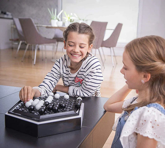 Abalone strategy game with marble board and pieces for family and kids to play