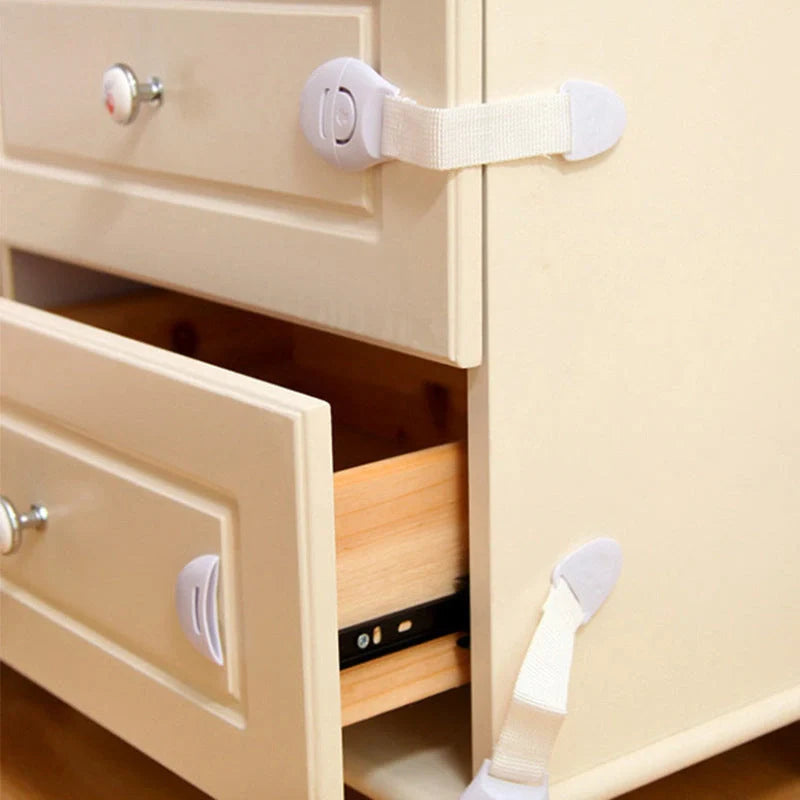Multifunctional baby safety lock in white, securing cabinet doors and drawers