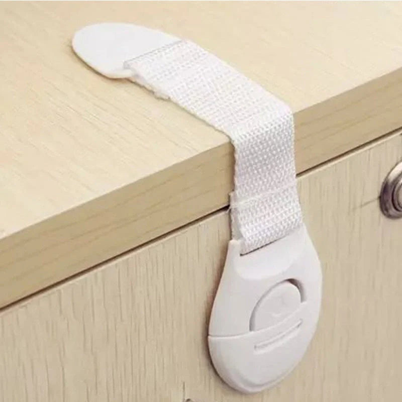 Multifunctional baby safety lock in white, securing cabinet doors and drawers