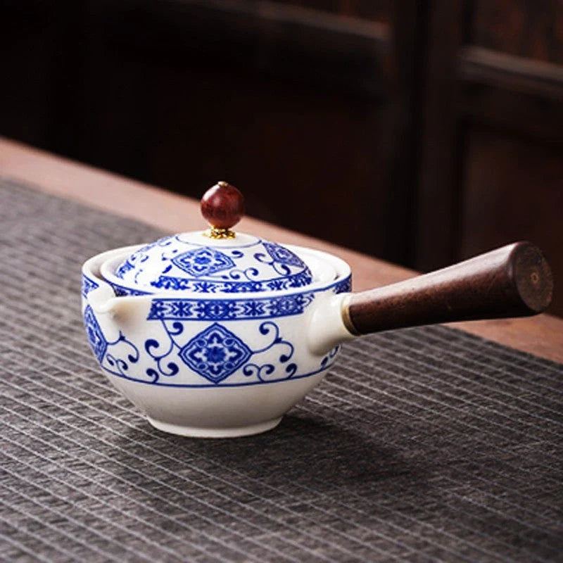Handcrafted ceramic teapot with wooden handle, designed for brewing traditional Oolong tea with enhanced flavour and aroma