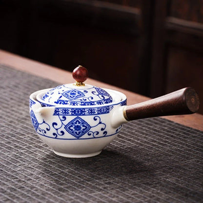 Handcrafted ceramic teapot with wooden handle, designed for brewing traditional Oolong tea with enhanced flavour and aroma