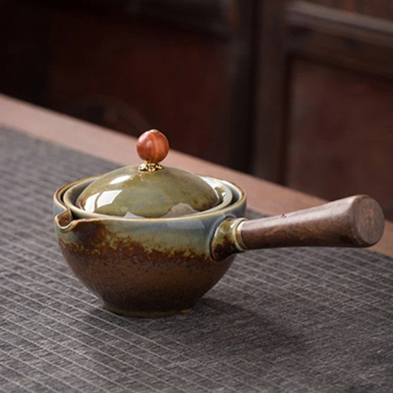 Handcrafted ceramic teapot with wooden handle, designed for brewing traditional Oolong tea with enhanced flavour and aroma