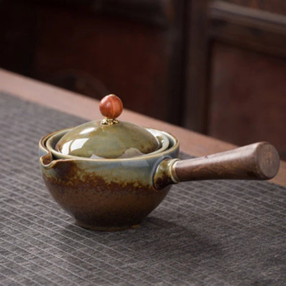 Handcrafted ceramic teapot with wooden handle, designed for brewing traditional Oolong tea with enhanced flavour and aroma