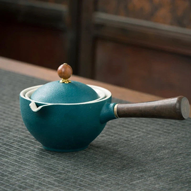 Handcrafted ceramic teapot with wooden handle, designed for brewing traditional Oolong tea with enhanced flavour and aroma