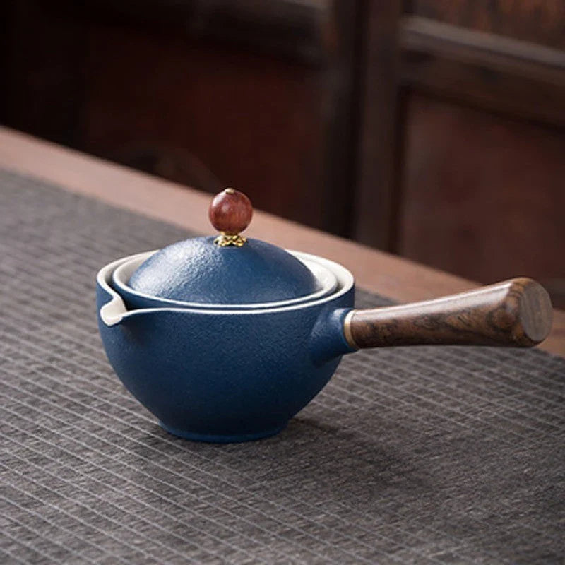 Handcrafted ceramic teapot with wooden handle, designed for brewing traditional Oolong tea with enhanced flavour and aroma