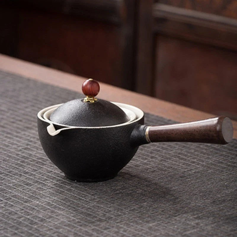 Handcrafted ceramic teapot with wooden handle, designed for brewing traditional Oolong tea with enhanced flavour and aroma