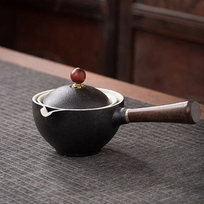 Handcrafted ceramic teapot with wooden handle, designed for brewing traditional Oolong tea with enhanced flavour and aroma