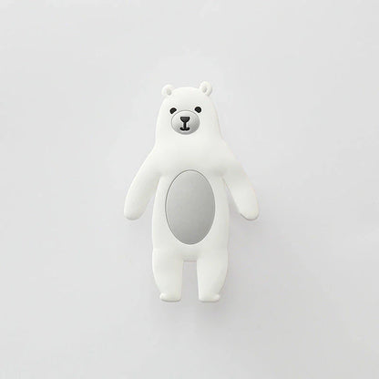 Assorted animal-shaped wall hooks in various colours, including bear, zebra, and cow designs, displayed on a white background