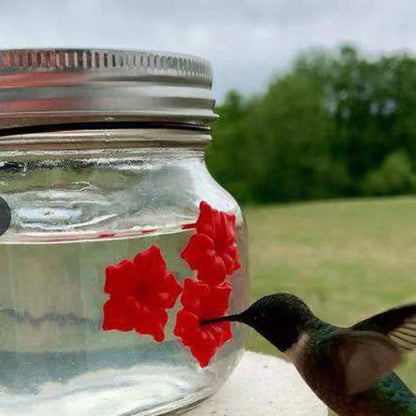 Elegant hummingbird feeder with flower-shaped design for attracting and feeding hummingbirds in the garden