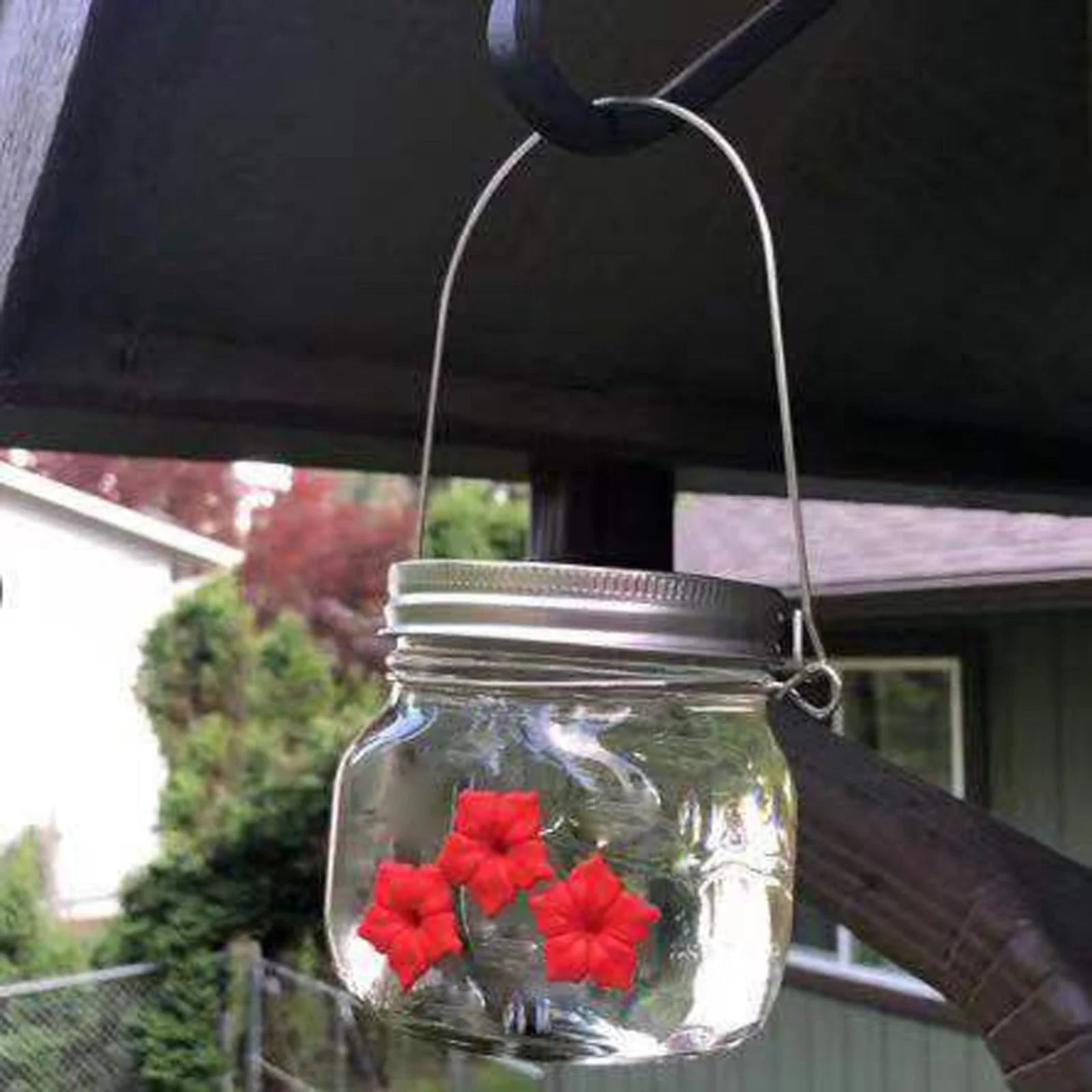 Elegant hummingbird feeder with flower-shaped design for attracting and feeding hummingbirds in the garden
