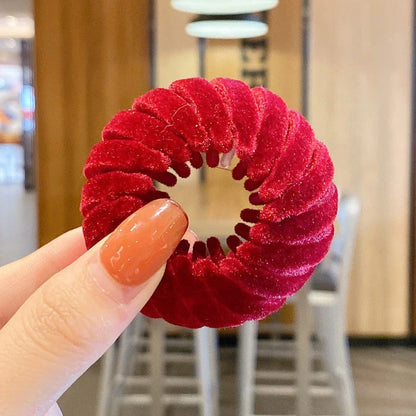 Elegant hair circle accessory with flexible design and teeth for creating stylish ponytails