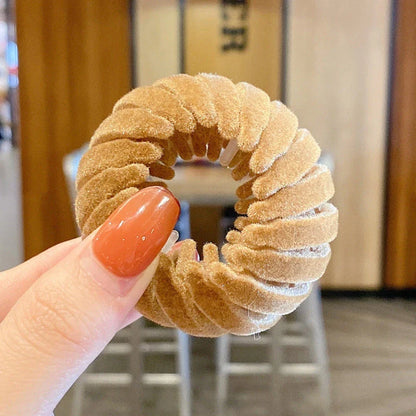 Elegant hair circle accessory with flexible design and teeth for creating stylish ponytails
