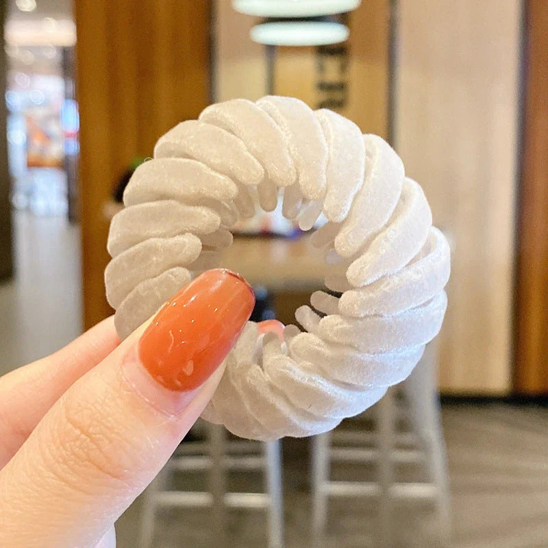 Elegant hair circle accessory with flexible design and teeth for creating stylish ponytails
