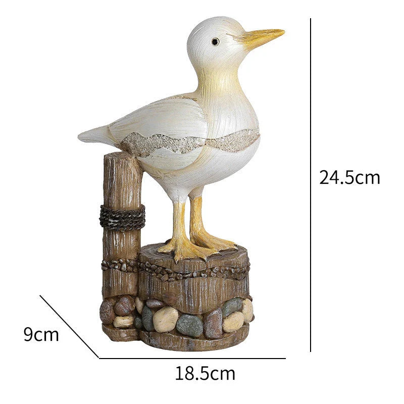 Resin seagull statue perched on a weathered wooden stump, bringing coastal charm to any indoor or outdoor space
