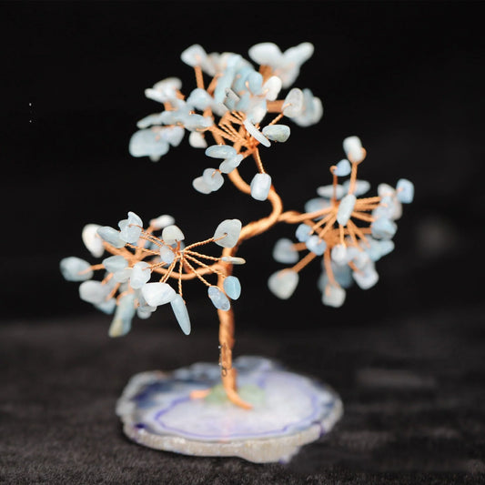 Aquamarine Crystal Fortune Tree Ornament with light blue hue and plant design