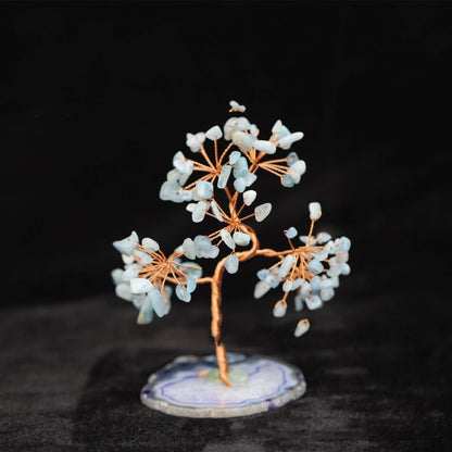 Aquamarine Crystal Fortune Tree Ornament with light blue hue and plant design