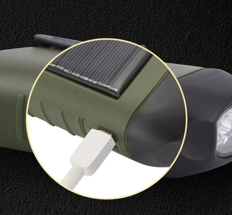 Hand-cranked LED flashlight with solar panel and carabiner clip