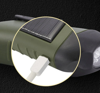 Hand-cranked LED flashlight with solar panel and carabiner clip