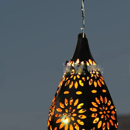 Solar-powered outdoor hanging lantern with flower-patterned shade, made of durable metal for long-lasting use in gardens, patios, and pathways.