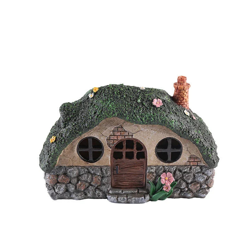 Solar-powered fairy house lamp with warm, inviting glow for outdoor garden decor