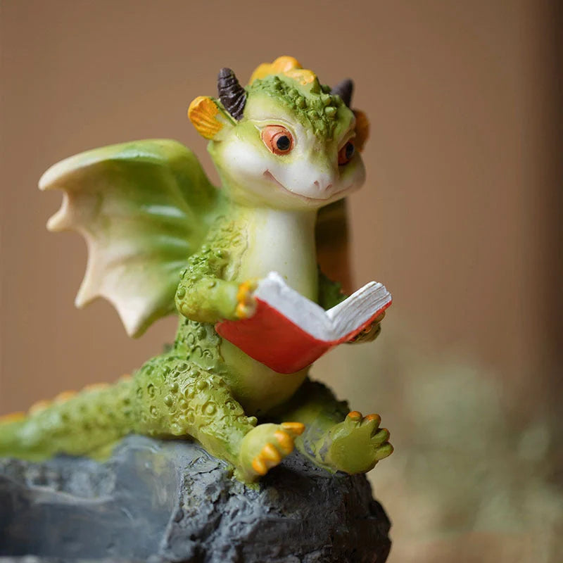 Hand-painted dinosaur succulent pots in three styles: Egg, Lying Stone, and Reading Dinosaurs