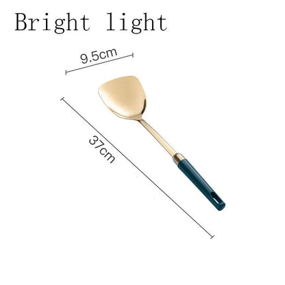 Elegant stainless steel kitchenware set with mirror-polished finish and gold-plated accents, including various utensils like shovels, spoons, ladles, and a serving frame
