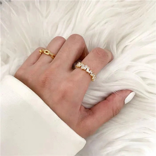 18K gold plated index finger ring with zircon accents on a white background